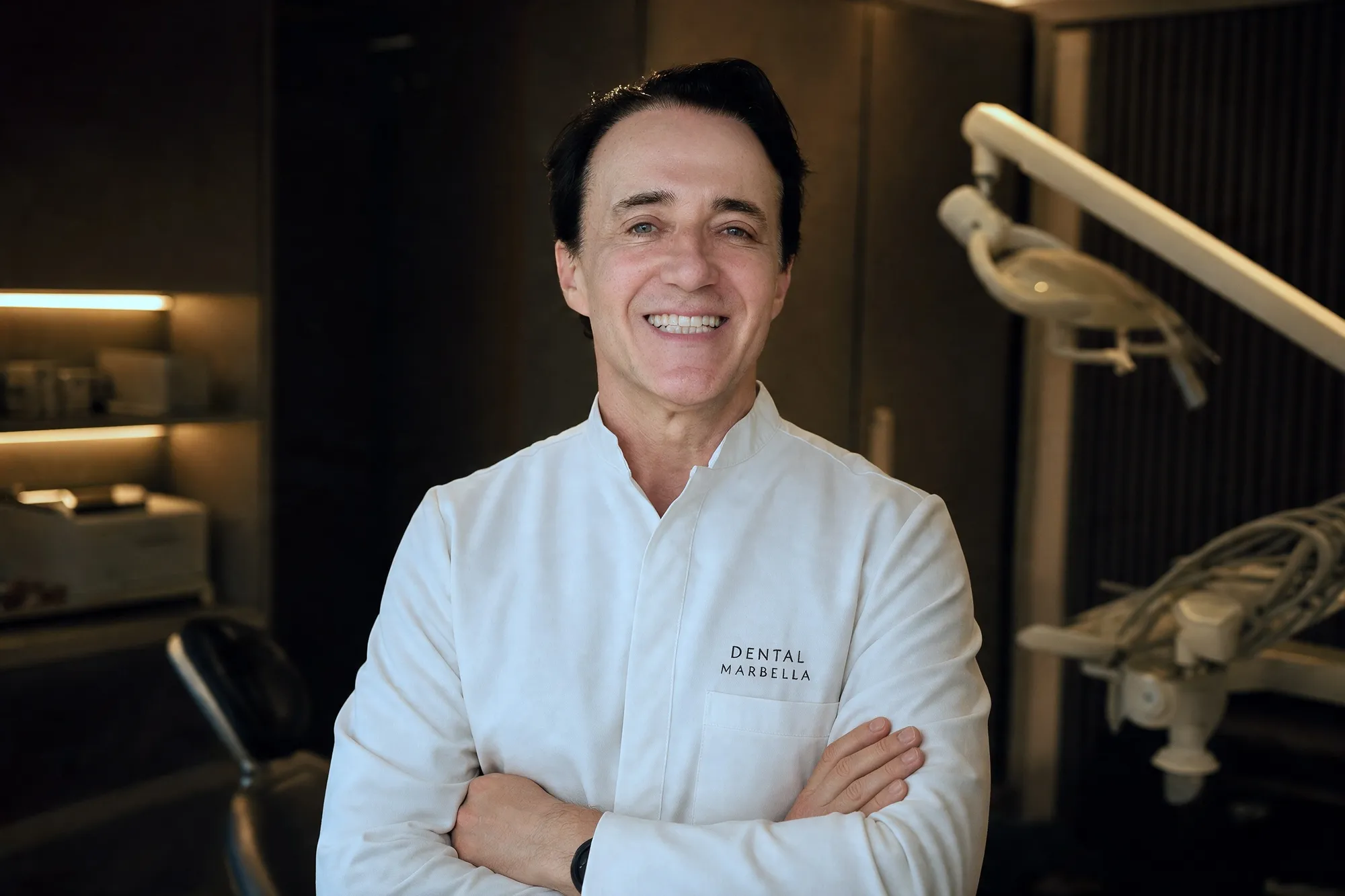 Dr. Sorin Cristea standing in his Marbella clinic in white scrubs