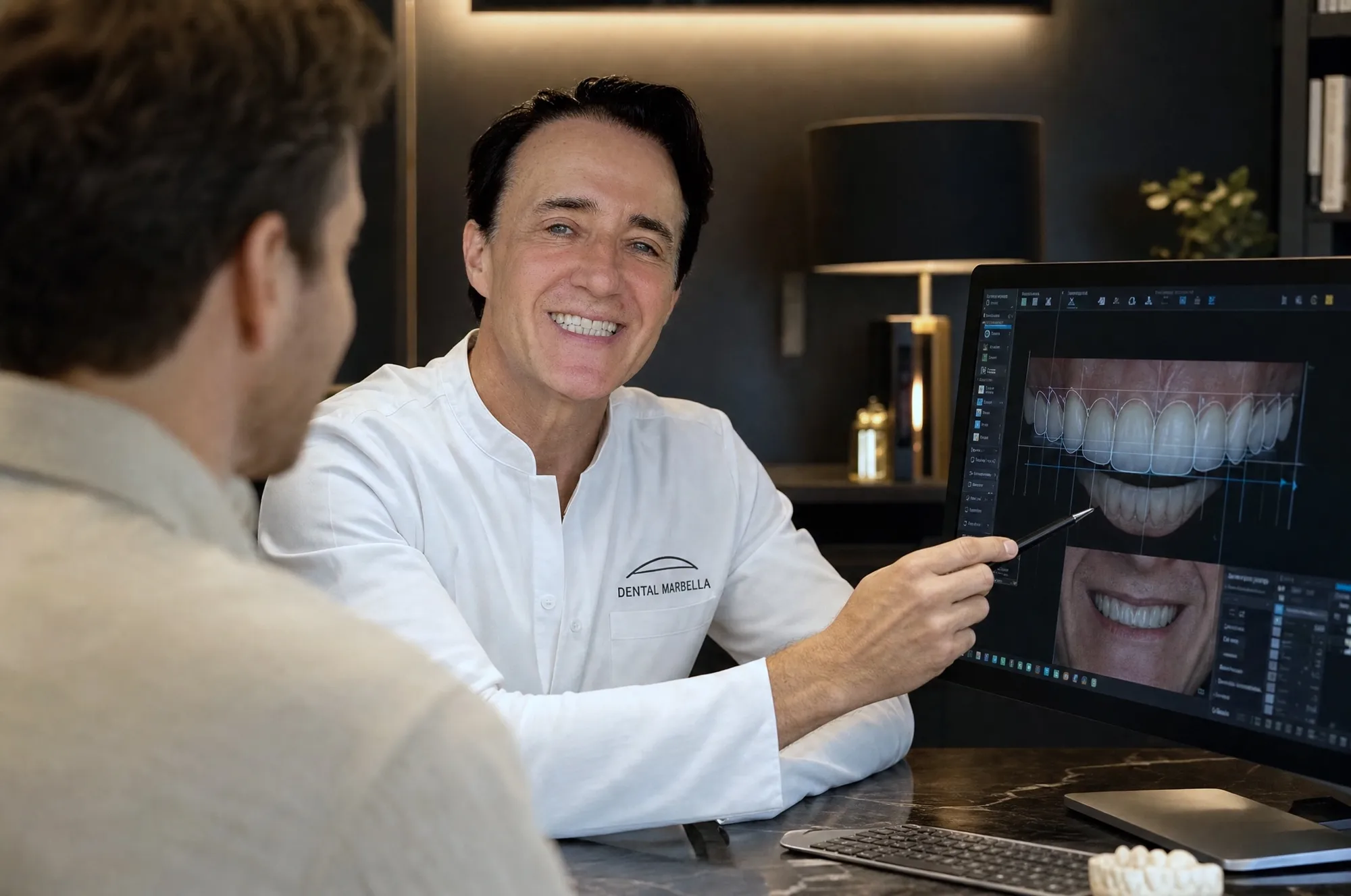Dr. Cristea consulting with a patient, pointing at a digital scan on screen
